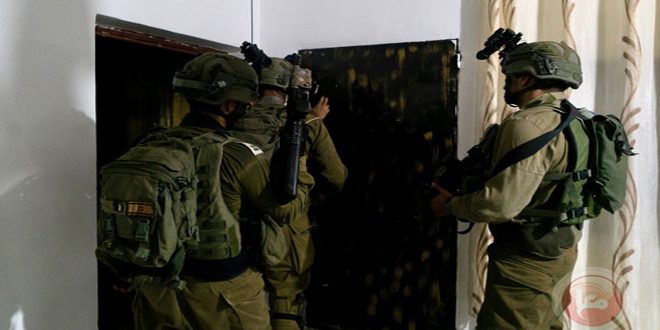 Israeli occupation troops arrest eighteen Palestinians in the West Bank
